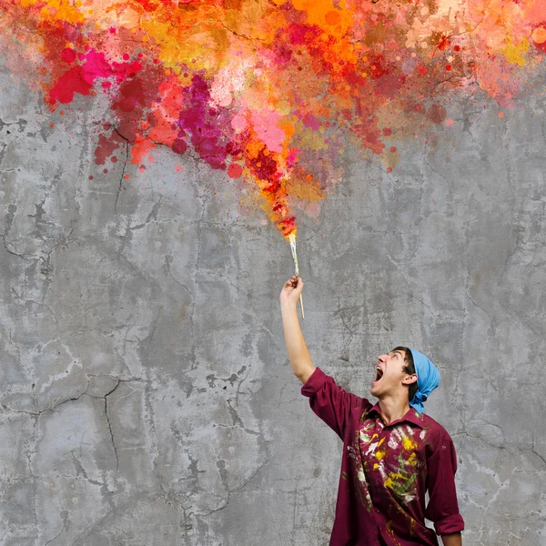 Handsome man painter with brush — Stock Photo, Image