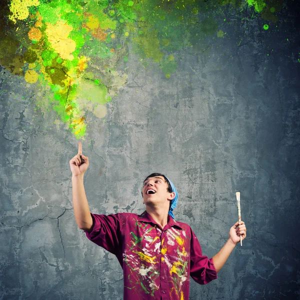 Handsome man painter with brush — Stock Photo, Image