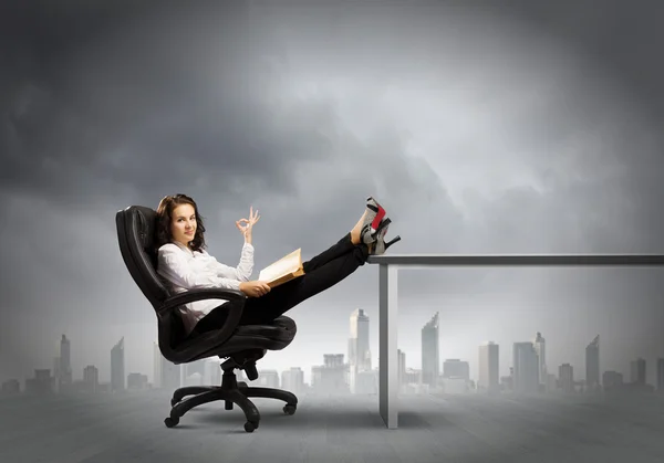 Young businesswoman with book — Stock Photo, Image