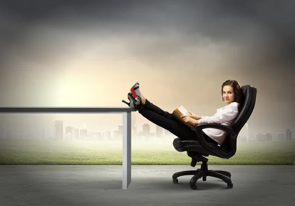 Young businesswoman with book — Stock Photo, Image