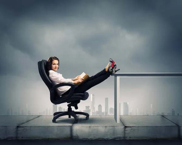 Young businesswoman with book — Stock Photo, Image