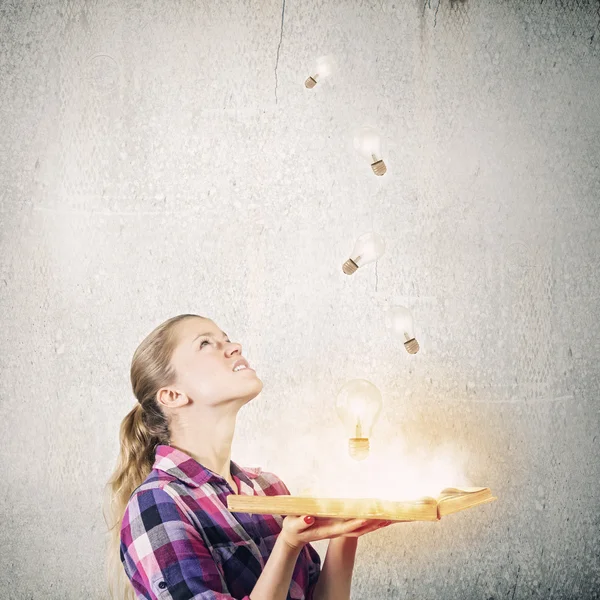 Woman holding opened book — Stock Photo, Image