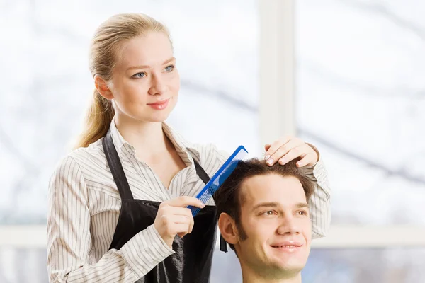 Young man and woman hairdresser — Stock Photo, Image