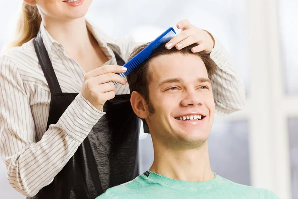 Young man and woman hairdresser — Stock Photo, Image