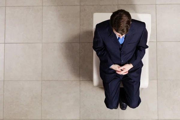 Businessman sitting in chair — Stock Photo, Image