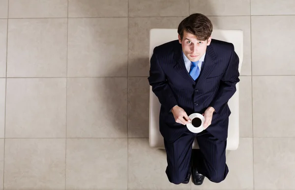 Businessman sitting in chair — Stock Photo, Image