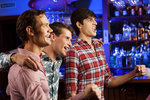 Young men watching match — Stock Photo, Image