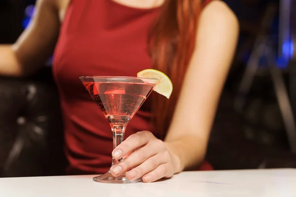 Woman with cocktail in hands — Stock Photo, Image
