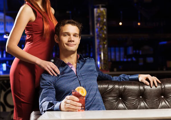 Elegant man and woman in bar — Stock Photo, Image