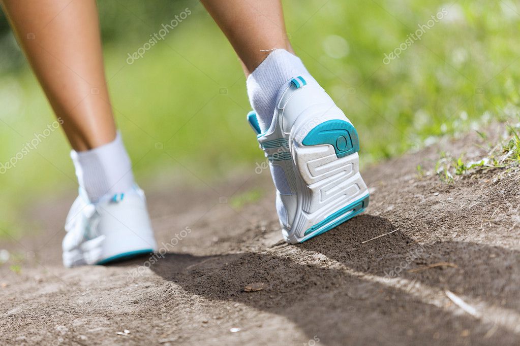 Female feet running on road Stock Photo by ©SergeyNivens 52585441