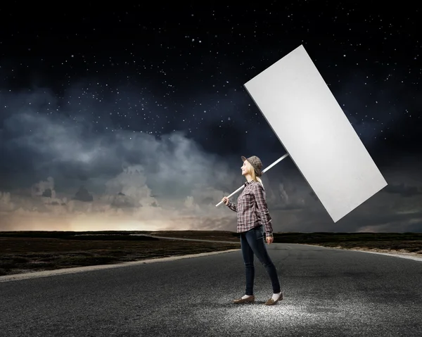 Woman carrying blank banner — Stock Photo, Image