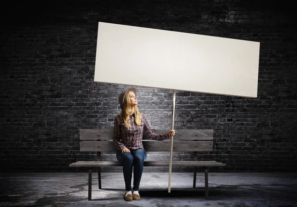 Woman holding white blank banner — Stock Photo, Image