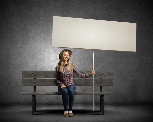 Woman holding white blank banner — Stock Photo, Image