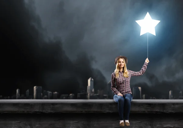 Woman with star balloon — Stock Photo, Image