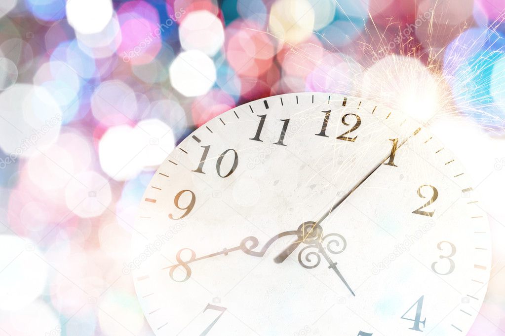 Clock with bokeh lights and firework