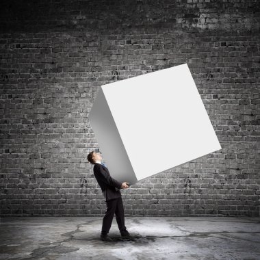 işadamı taşıyan beyaz küp