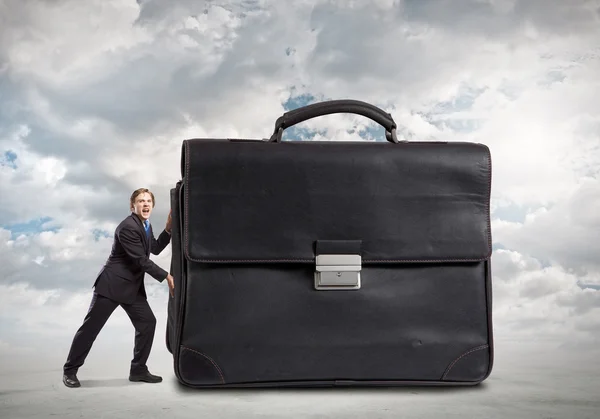 Businessman move macro suitcase — Stock Photo, Image