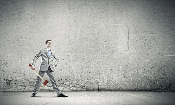 Determined businessman with axe — Stock Photo, Image