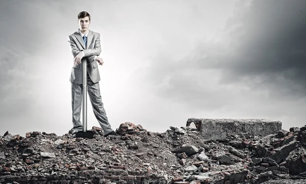 Young businessman with hammer — Stock Photo, Image