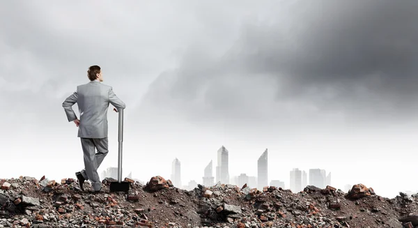 Young businessman with hammer — Stock Photo, Image