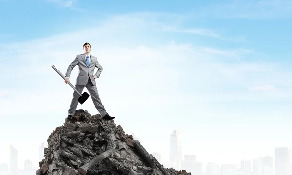 Young businessman with hammer — Stock Photo, Image