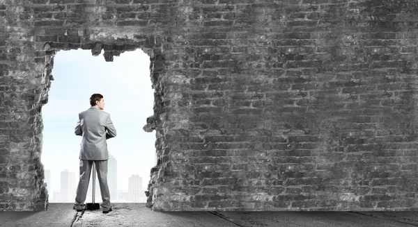 Businessman with big hammer — Stock Photo, Image