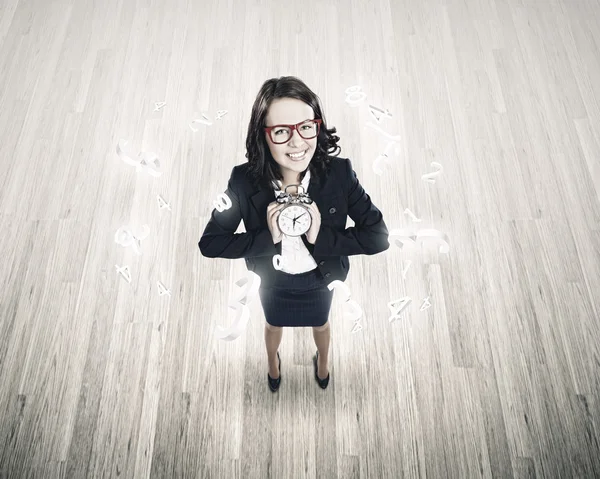 Businesswoman holding alarm clock — Stock Photo, Image