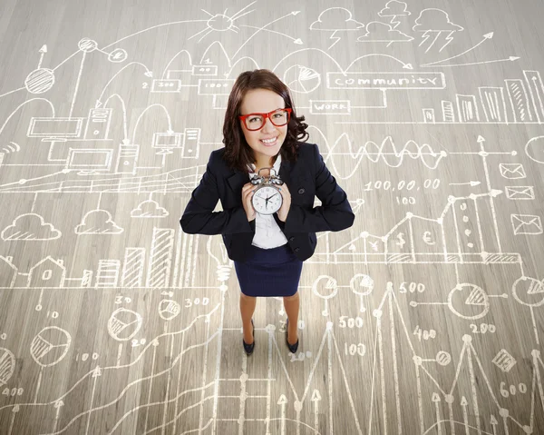 Businesswoman holding alarm clock — Stock Photo, Image