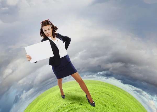 Businesswoman holding blank banner — Stock Photo, Image