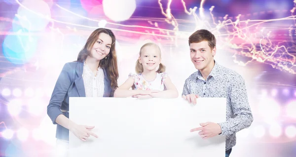 Family with white blank banner — Stock Photo, Image