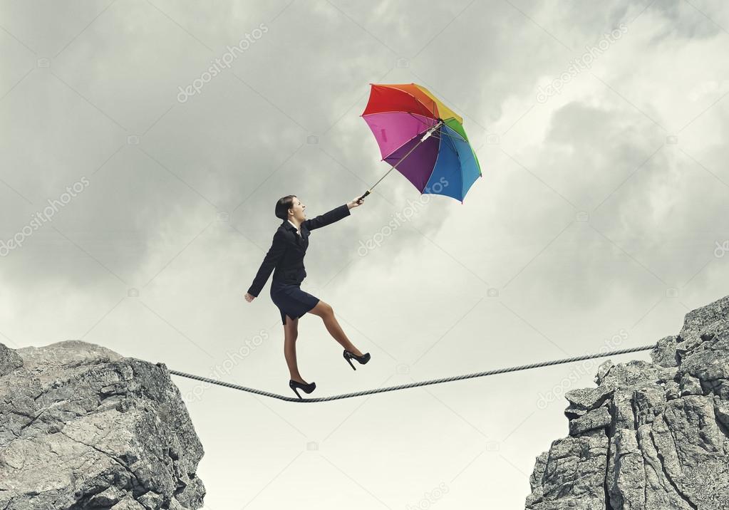 Businesswoman with umbrella