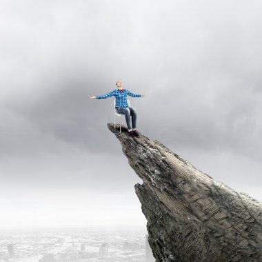 Woman on top of rock clipart
