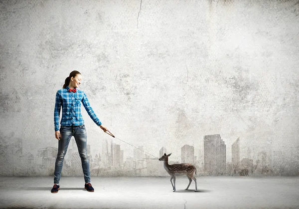 Woman holding fawn on lead — Stock Photo, Image