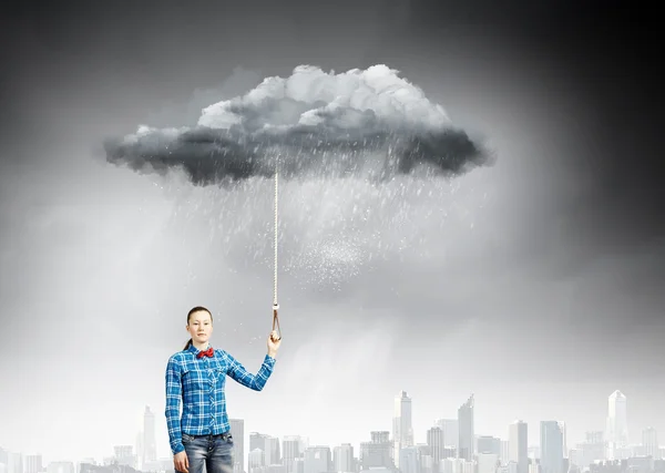 Woman holding cloud on lead — Stock Photo, Image