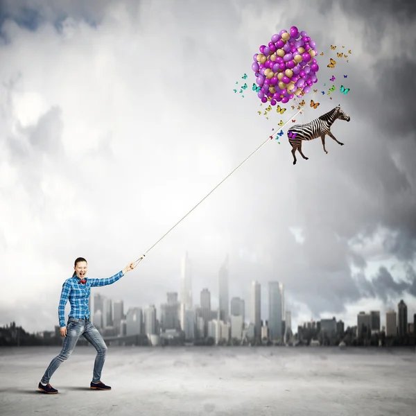 Woman and flying zebra — Stock Photo, Image