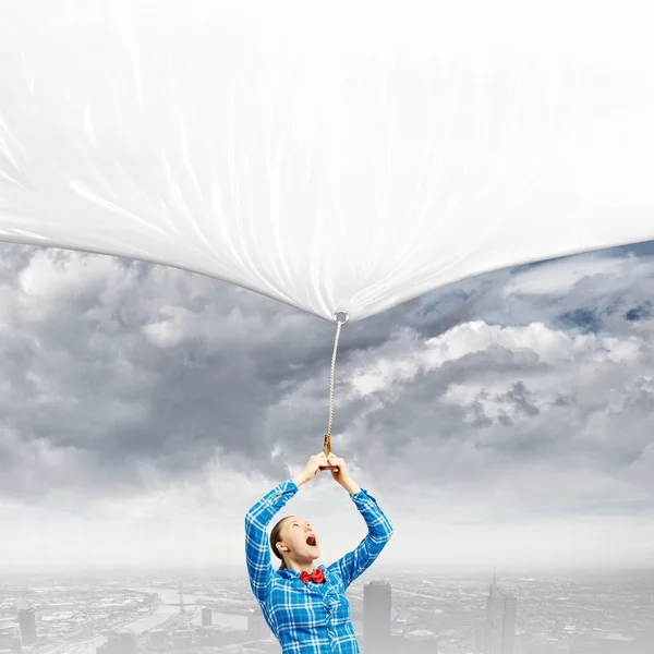 Woman pulling blank banner — Stock Photo, Image