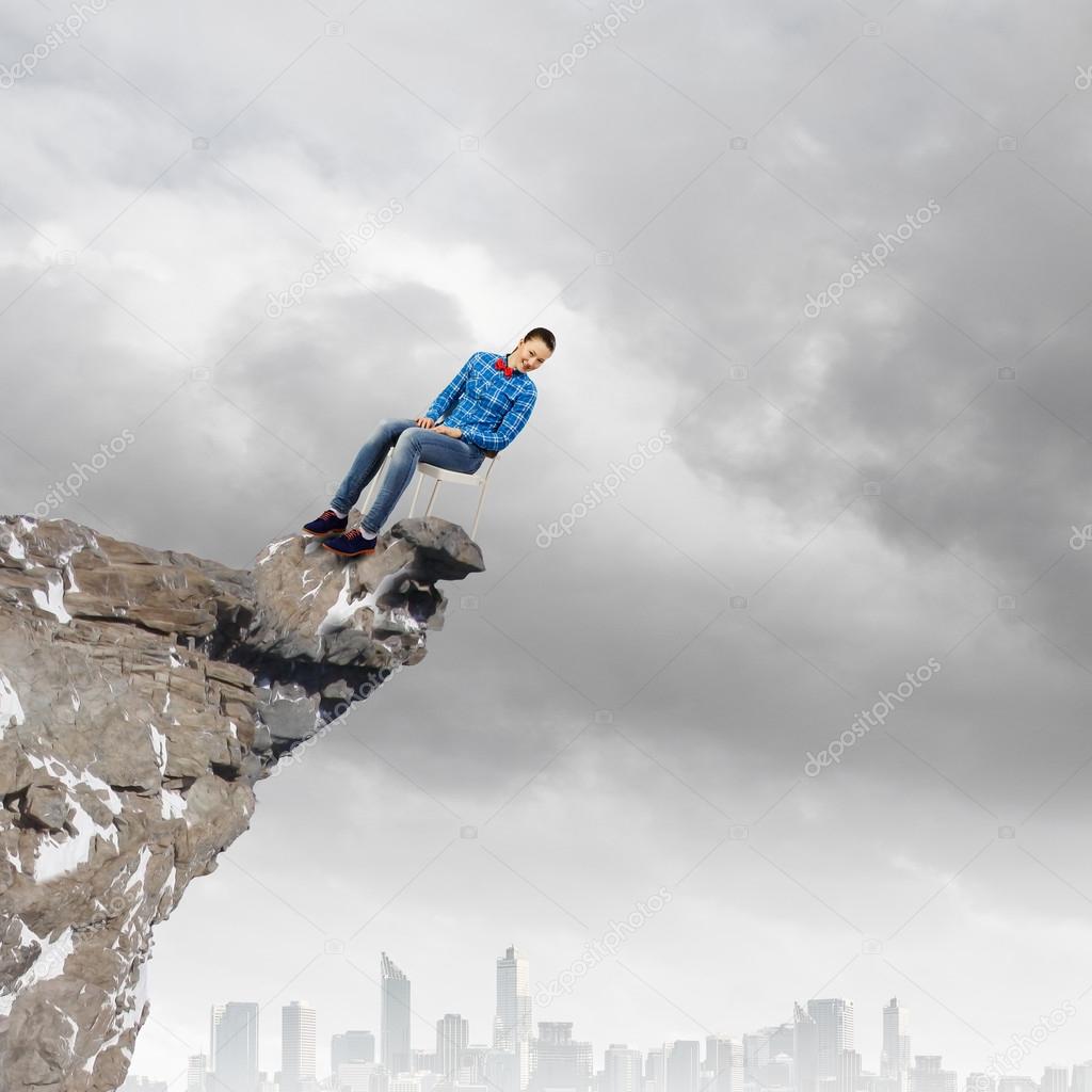 Woman on top of rock