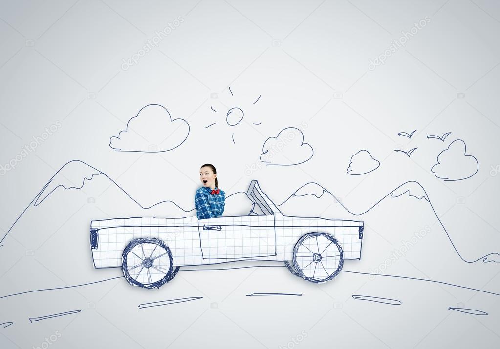 Young woman driving car