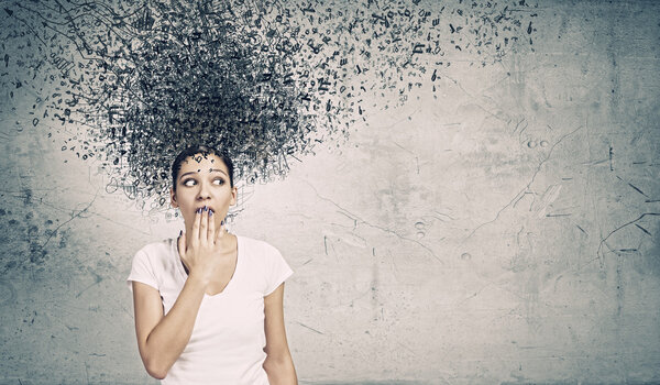 Woman closing mouth with palm