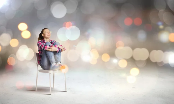 Woman sitting on chair — Stock Photo, Image