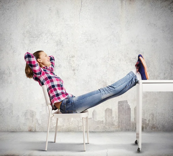 Woman with legs on table — Stock Photo, Image