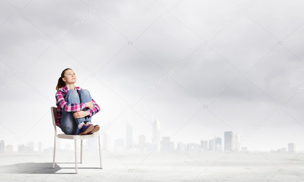 Girl sitting in chair
