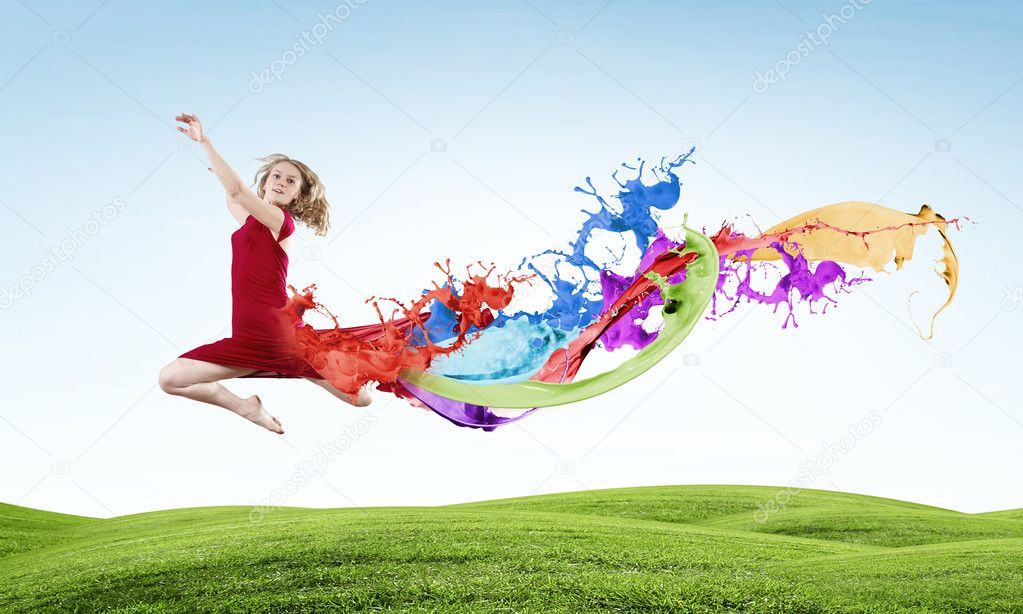 Young woman dancer jumping
