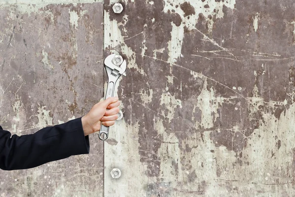 Hand fixing mechanism with spanner — Stock Photo, Image