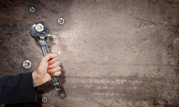 Hand fixing mechanism with spanner — Stock Photo, Image