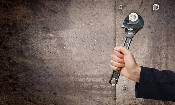 Hand fixing mechanism with spanner — Stock Photo, Image