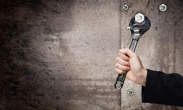 Hand fixing mechanism with spanner — Stock Photo, Image