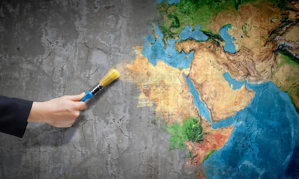 Hand painting Earth planet with brush — Stock Photo, Image