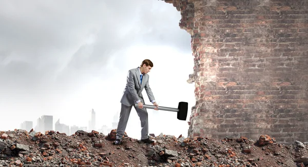 Businessman with hammer — Stock Photo, Image