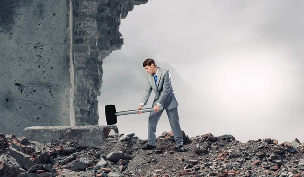 Businessman with hammer — Stock Photo, Image